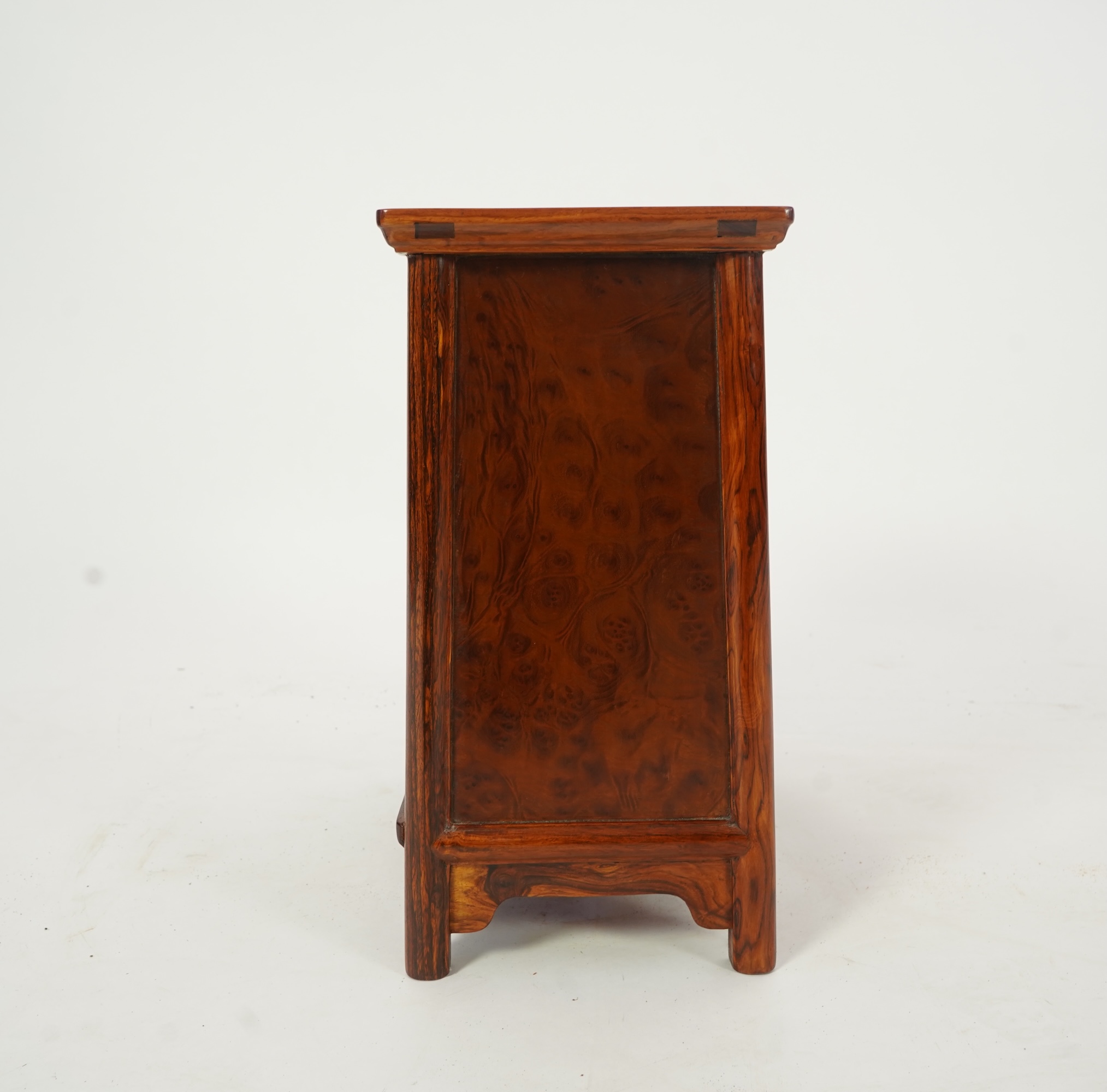 A Chinese huanghuali and burrwood panelled round-corner kang cabinet, 20th century